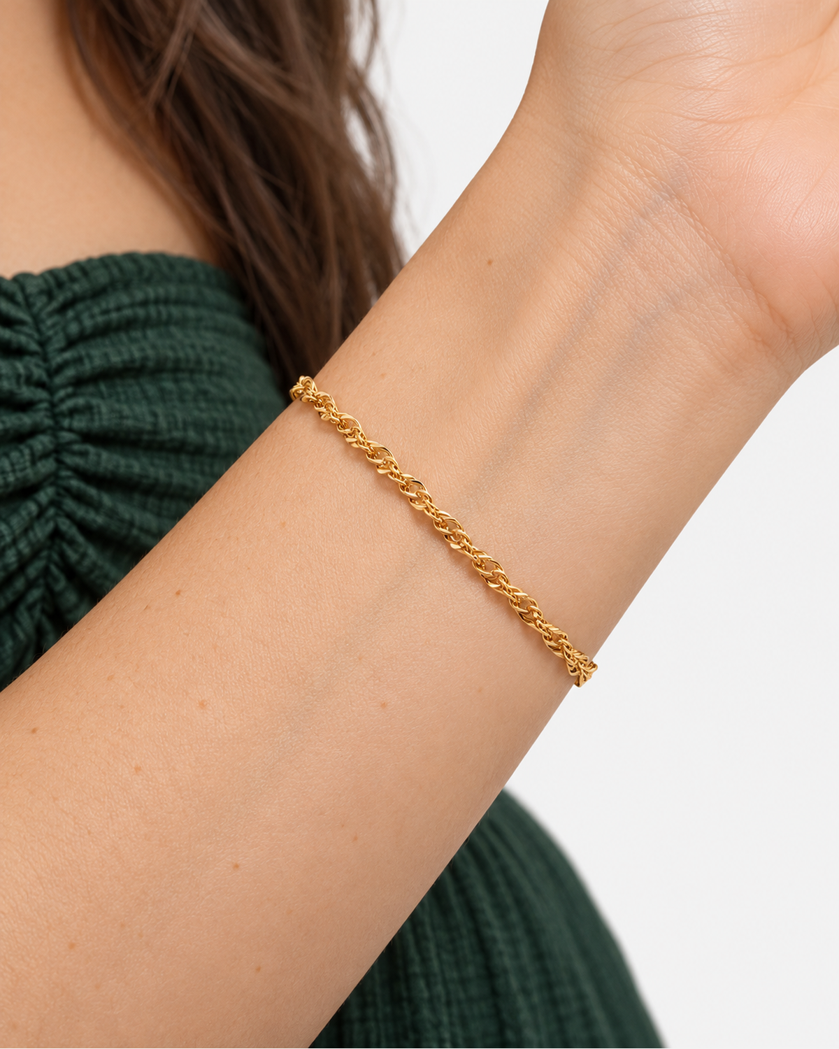 Nixie Chic Bracelet — Gold wearing macro with forest-green beach co-ord