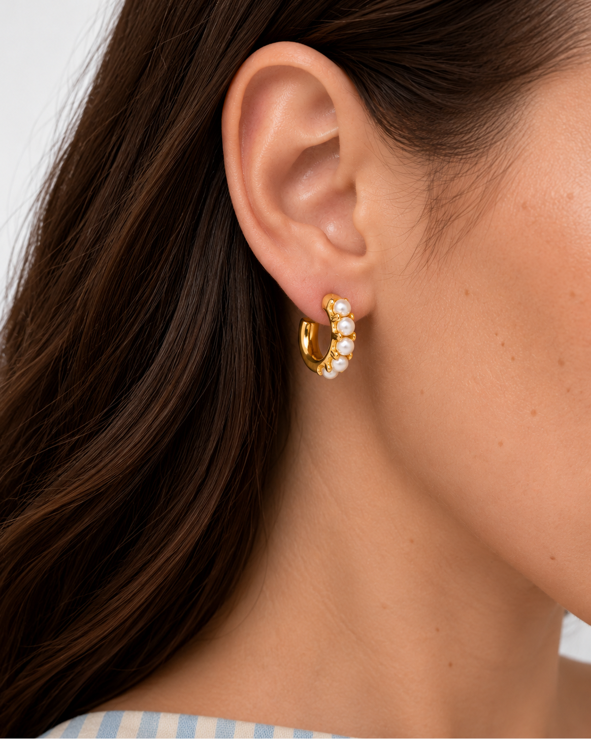 Dalia Mini Pearl Huggies Earrings — Gold — close-up model scale detail
