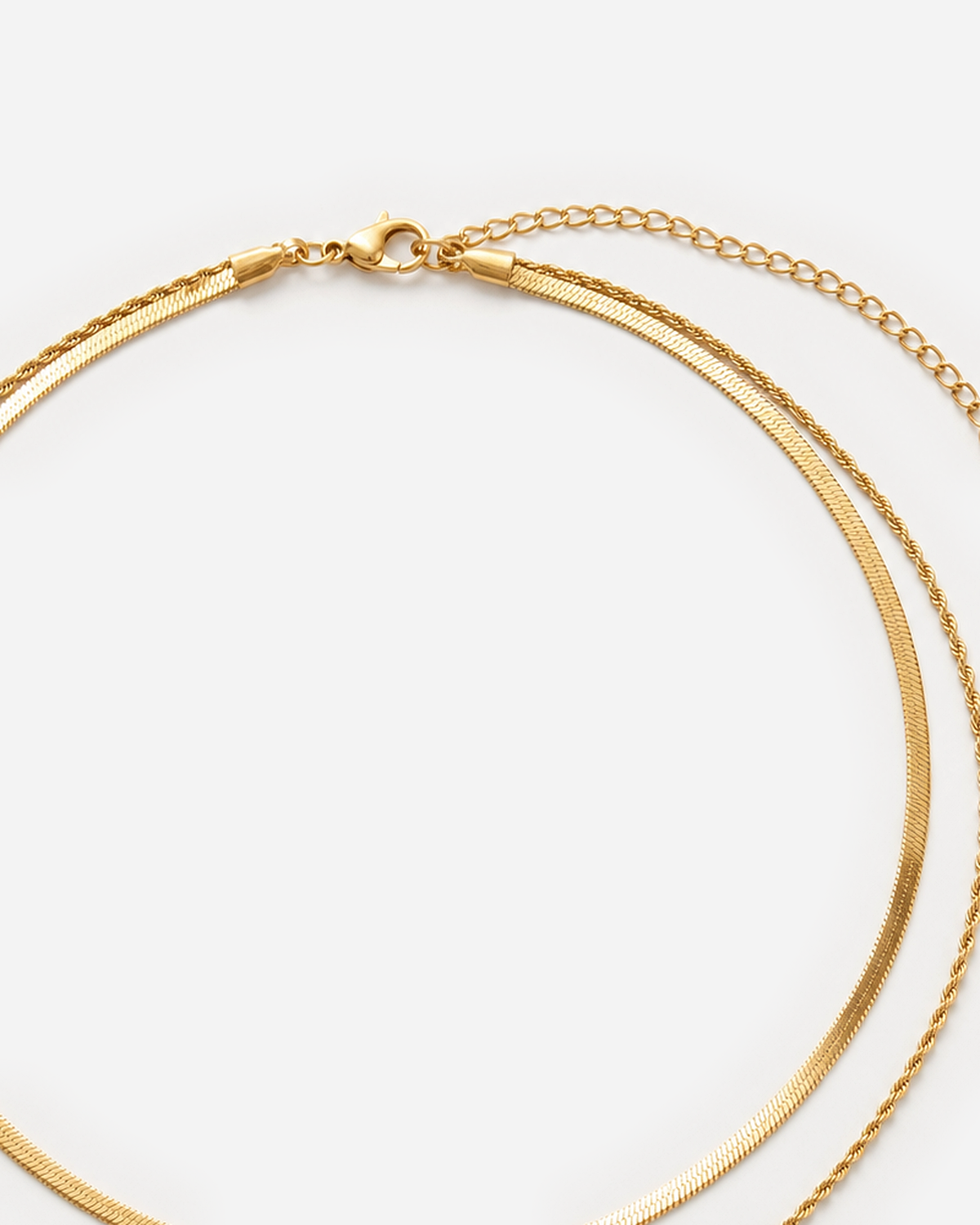 Gold lobster clasp, extender and layered herringbone and rope-chain closure detail