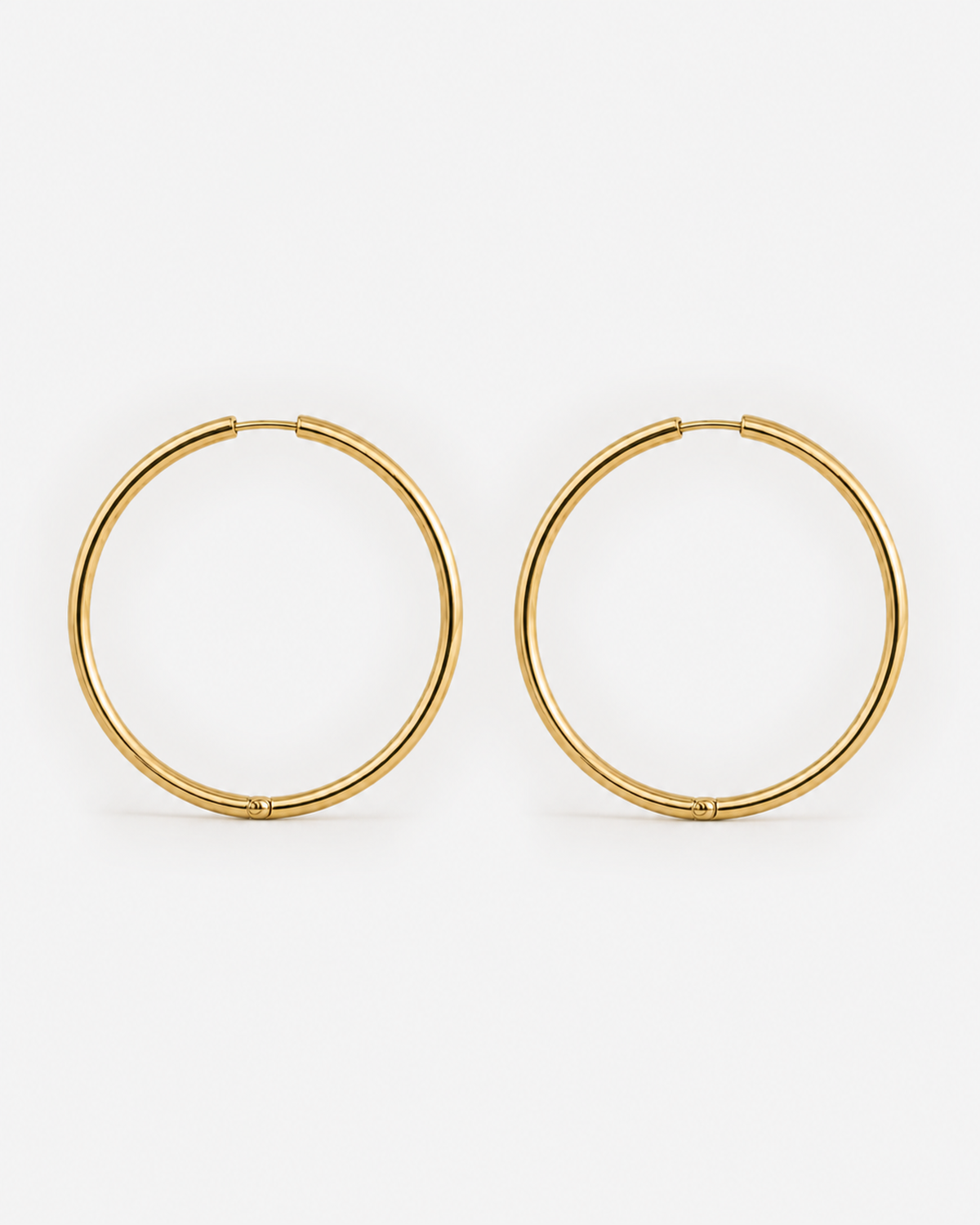 Willa Thin Hoop Earrings — Gold closed hinged closure detail