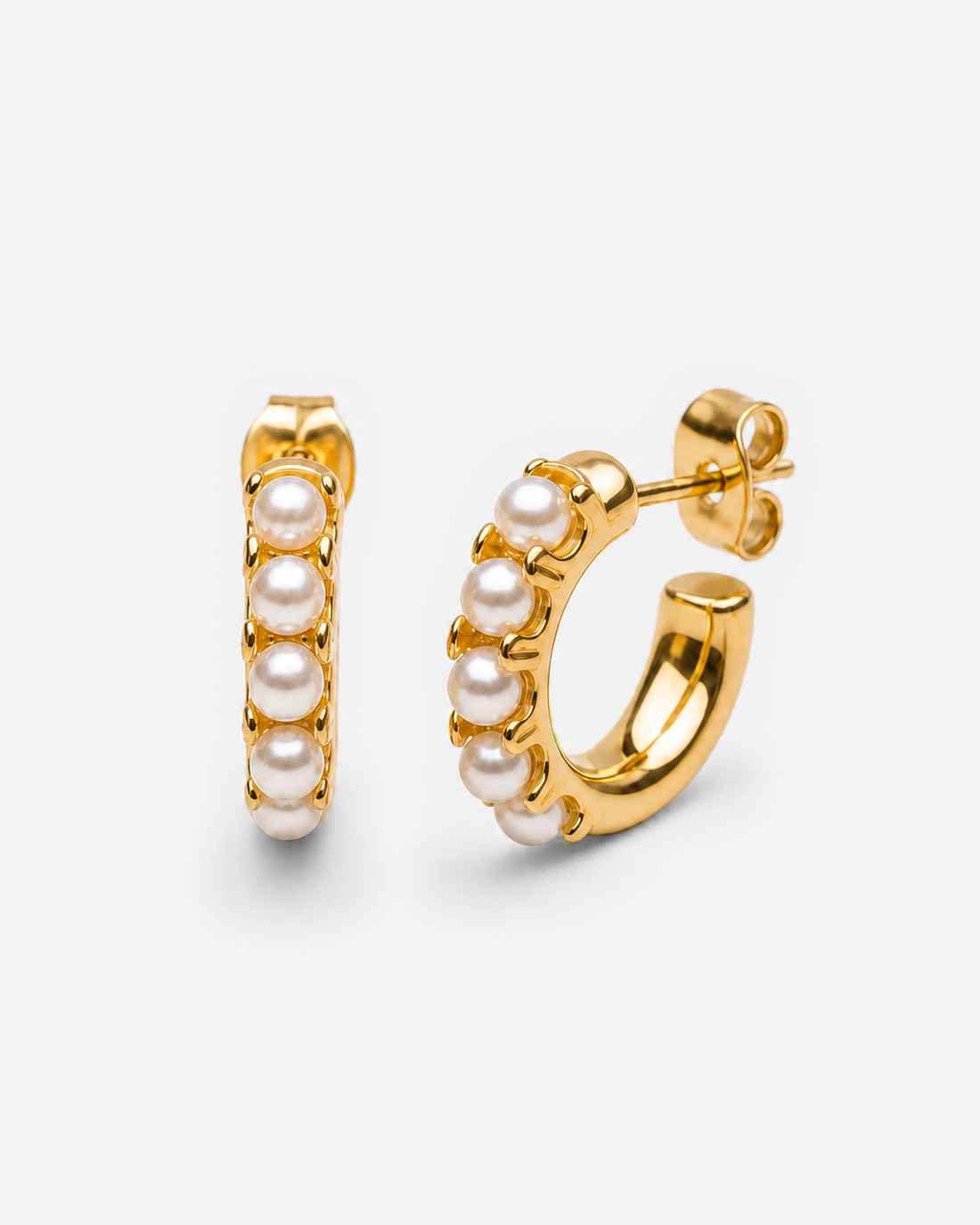 Gold-tone huggie hoops with smooth white round bead accents along the front.