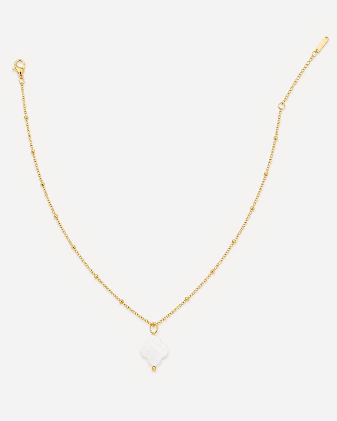 Anouk gold-tone necklace with spaced round beads and a white four-lobed pendant
