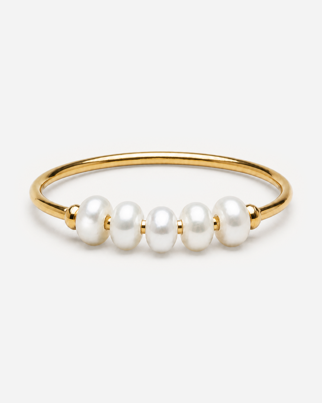 Bronte gold-tone ring with five white oval pearls across the front