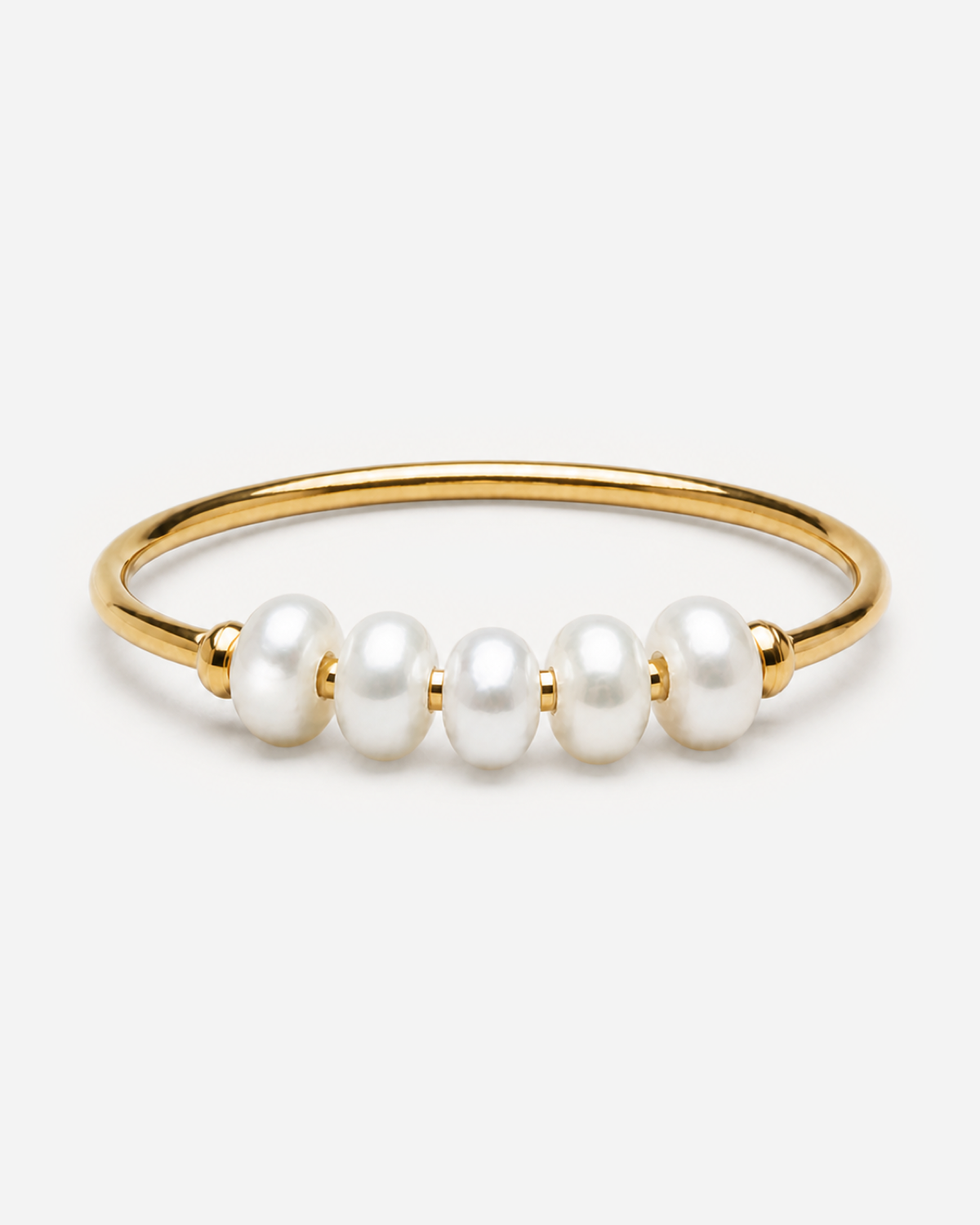Bronte gold-tone ring with five white oval pearls across the front