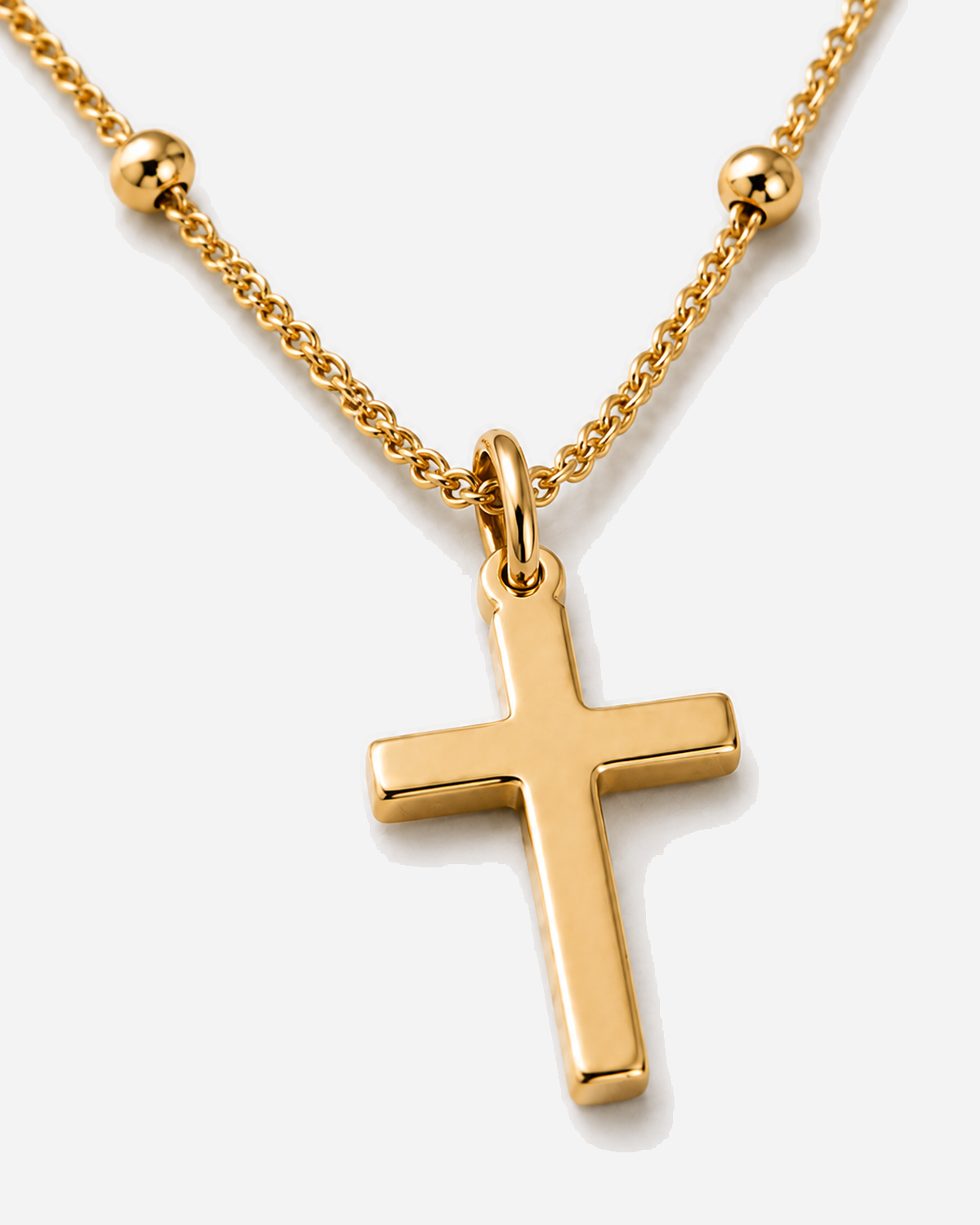 Isolde gold-tone plain cross pendant with round bead stations on the chain