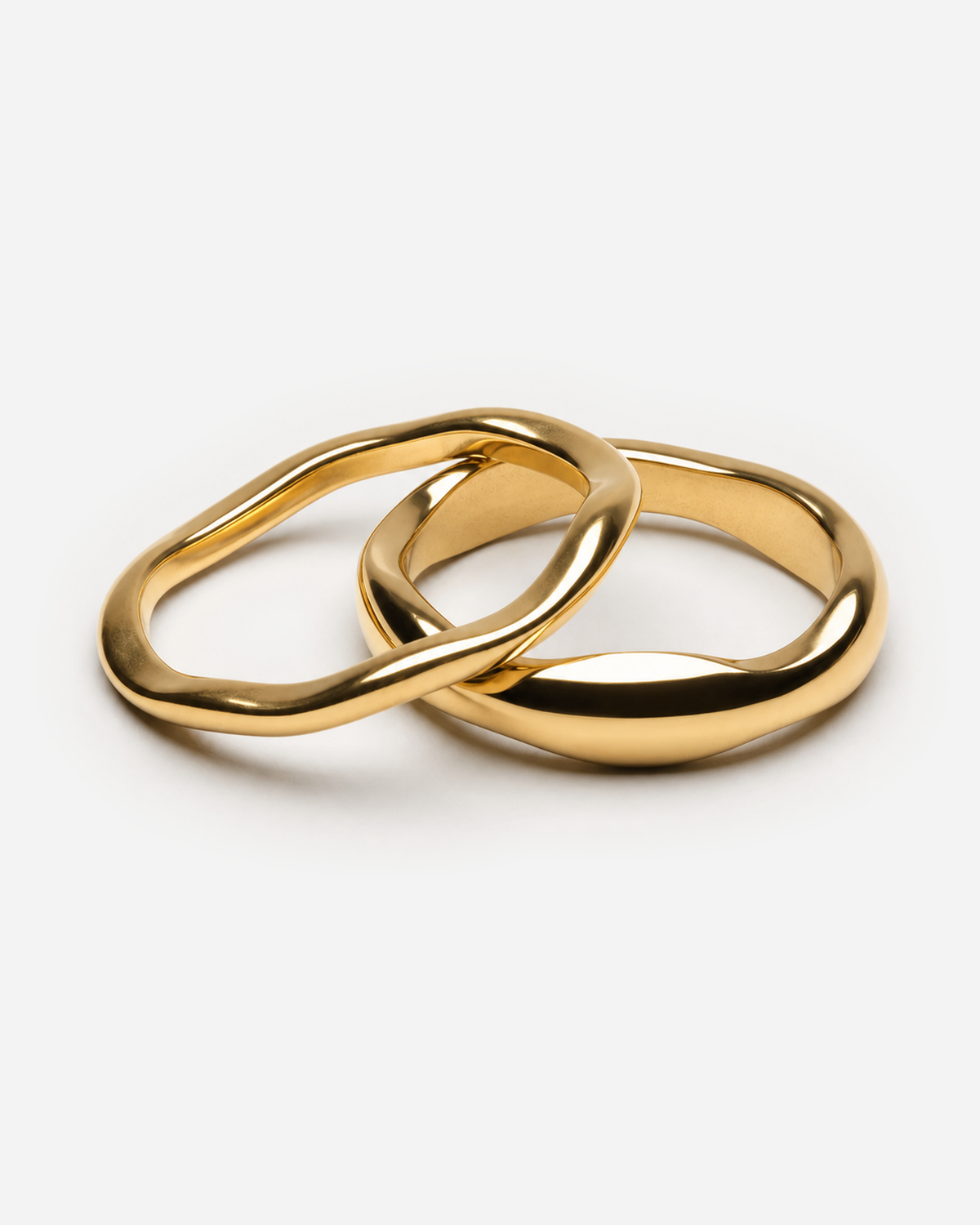 Carys gold-tone ring pair with one narrow wavy band and one wider rounded band
