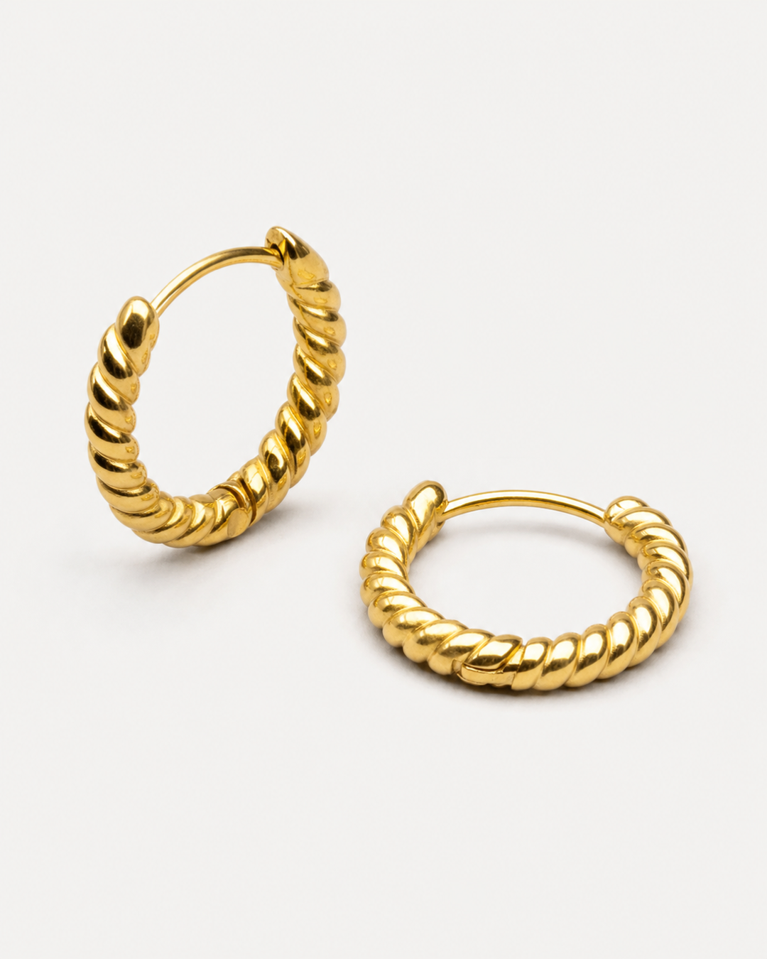 Cleo Twisted Hoops Earrings — Gold — light grey product hero