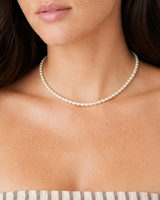 Elara Freshwater Pearl Choker — 04 — Gold — dusty-plum/taupe outfit — front wearing view