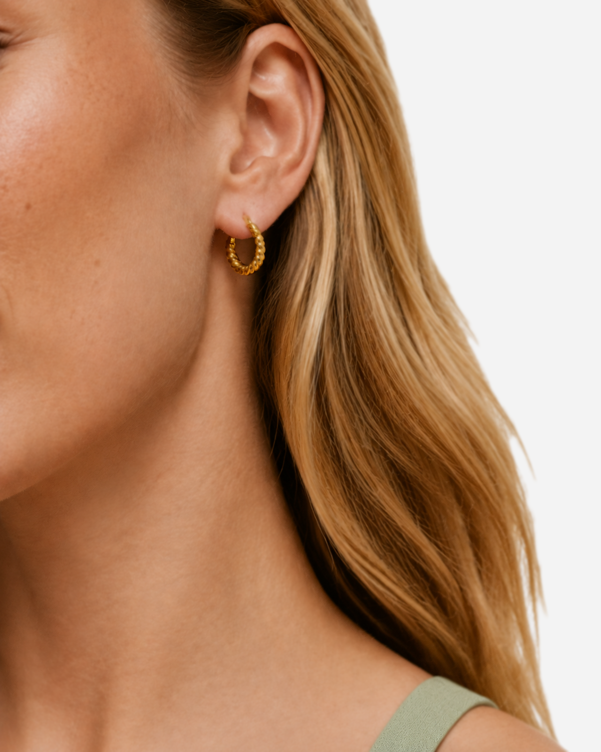 Cleo Twisted Hoops Earrings — Gold — model three-quarter view