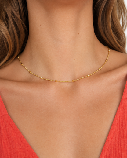 Delja Beaded Necklace — Gold — model wider editorial view