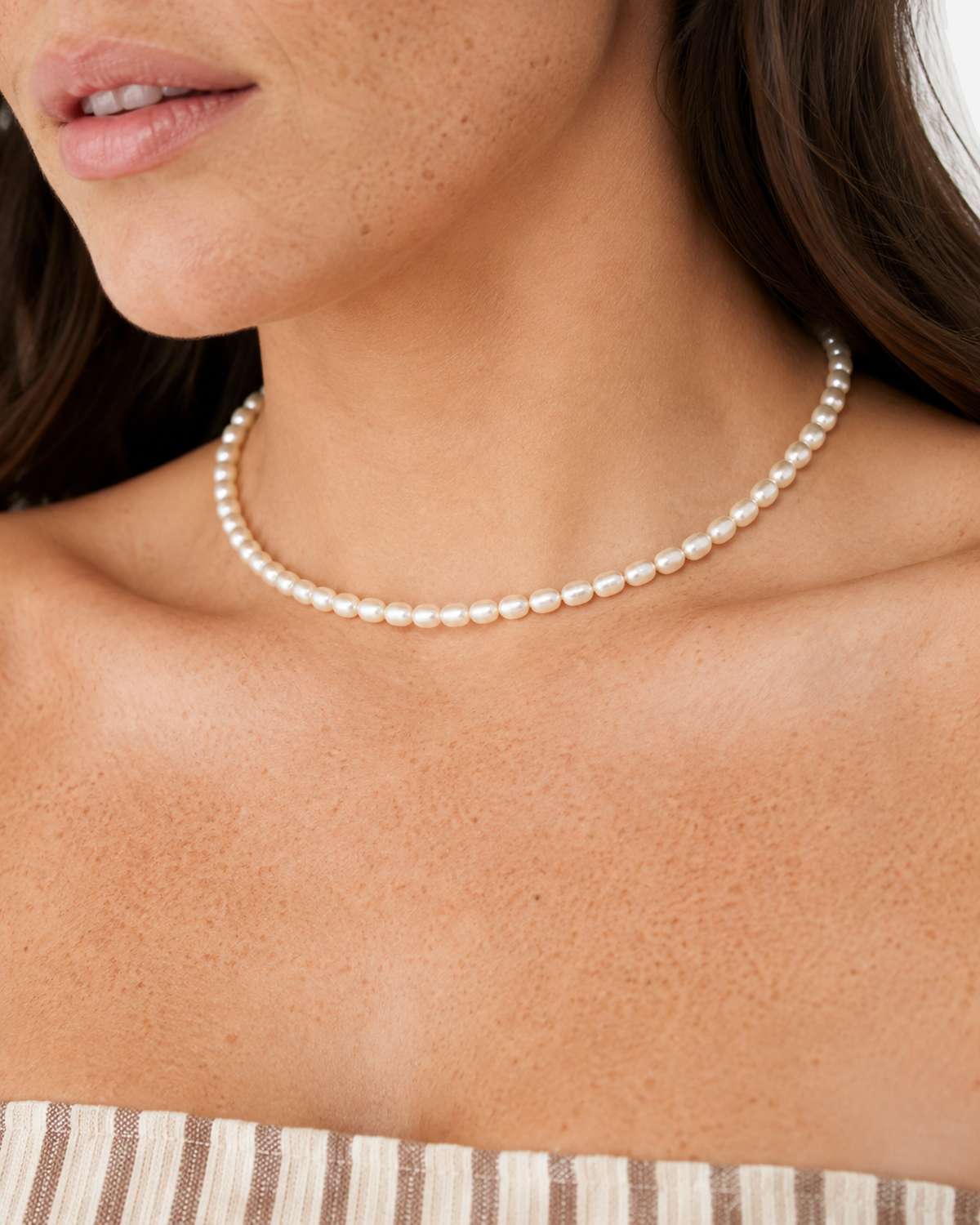 Elara Freshwater Pearl Choker — 06 — Gold — dusty-plum/taupe outfit — wider upper-torso view