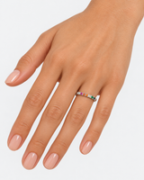 Silver-tone multicoloured ring worn with the arms crossed
