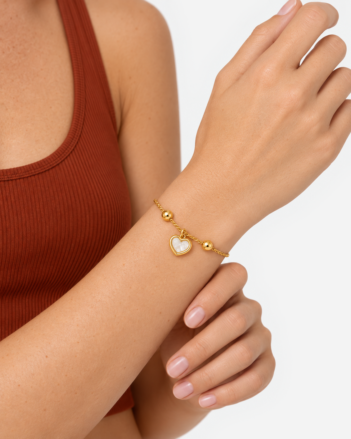 Muriel Heart Shell Bracelet — 08 — Gold — sea-glass/ivory outfit — on-wrist macro
