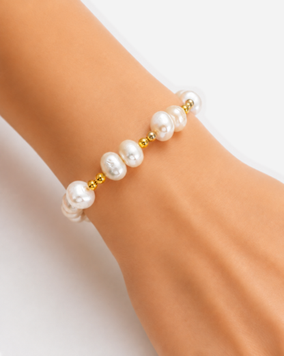 Dara Pearl Bracelet — 08 — Gold — apricot/seafoam outfit — on-wrist macro