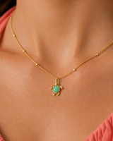 Celine Opal Turtle Necklace — Gold — close-up model scale detail