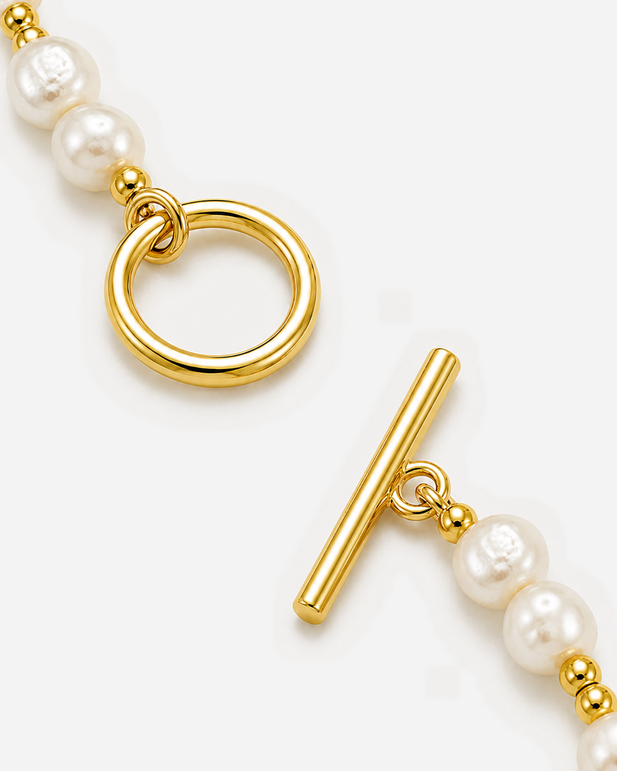 Dara Pearl Bracelet — 09 — Gold — ring-and-T-bar toggle construction