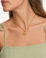 Marisol Golden Sun Necklace — 23 — Gold — shell-white open-collar resort shirt — model three-quarter