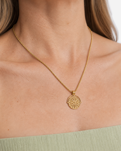 Marisol Golden Sun Necklace — 25 — Gold — shell-white open-collar resort shirt — collar-hand wearing close-up