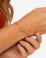 Ayana Flower Bracelet — 05 — Gold — tomato-red CO16 — supported-hands close-up