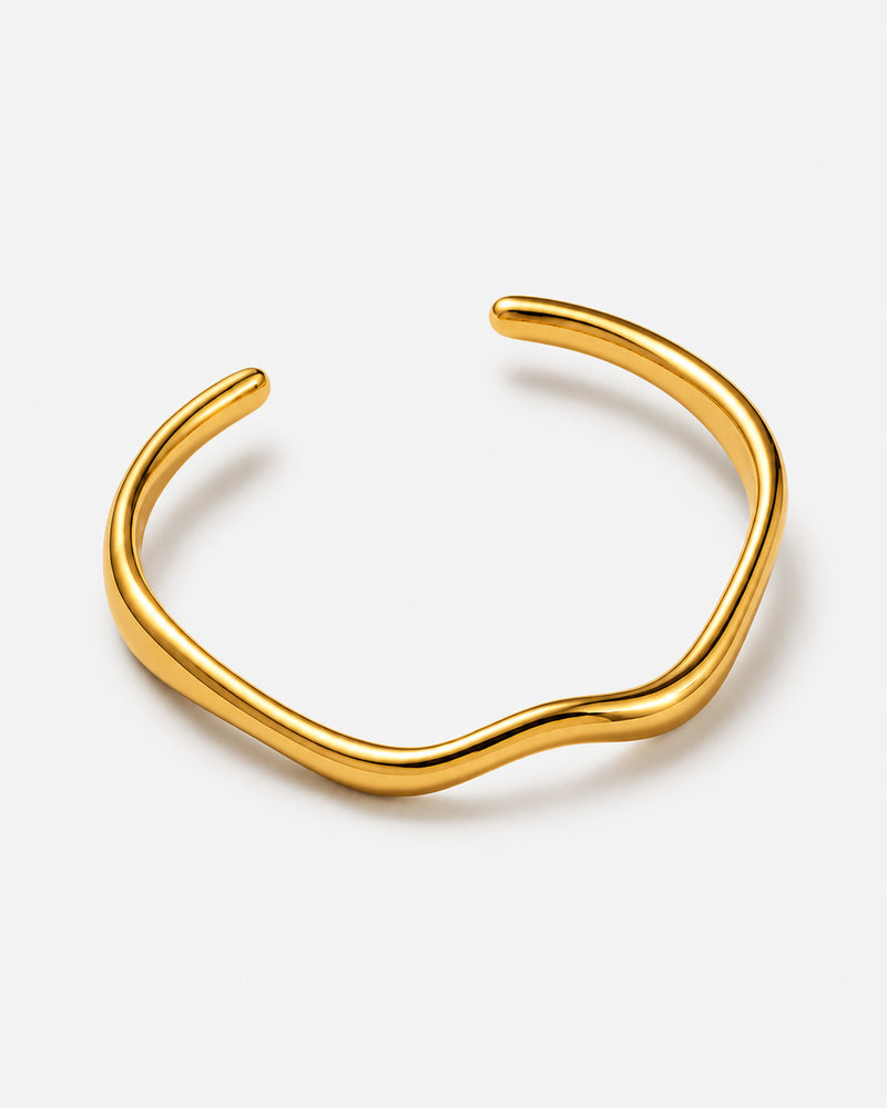 Naia polished gold-tone open cuff with a wave-shaped curve
